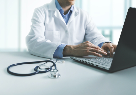 Male doctor on computer