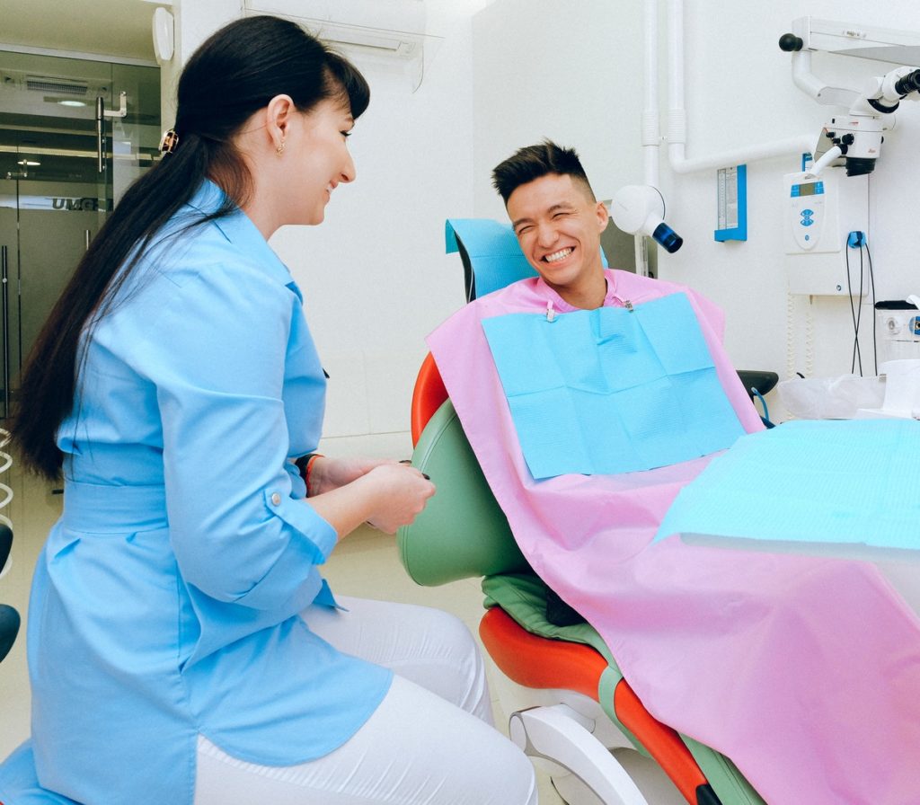 dentist working with a patient in the dental chair