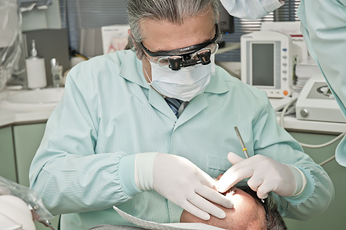 dentist at work on a patient's teeth